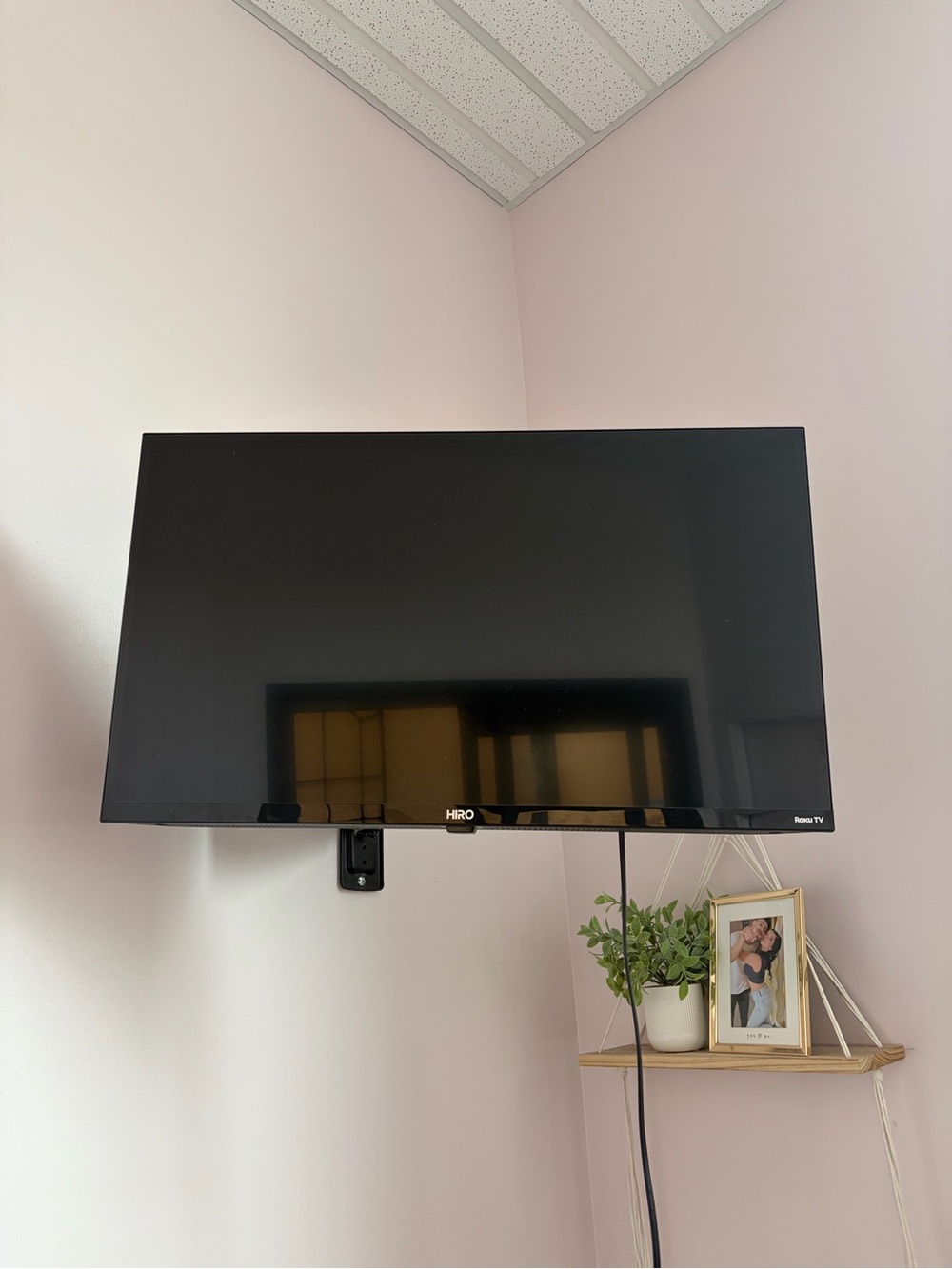 IRO Black Wall-Mounted TV with Glossy Black Finish